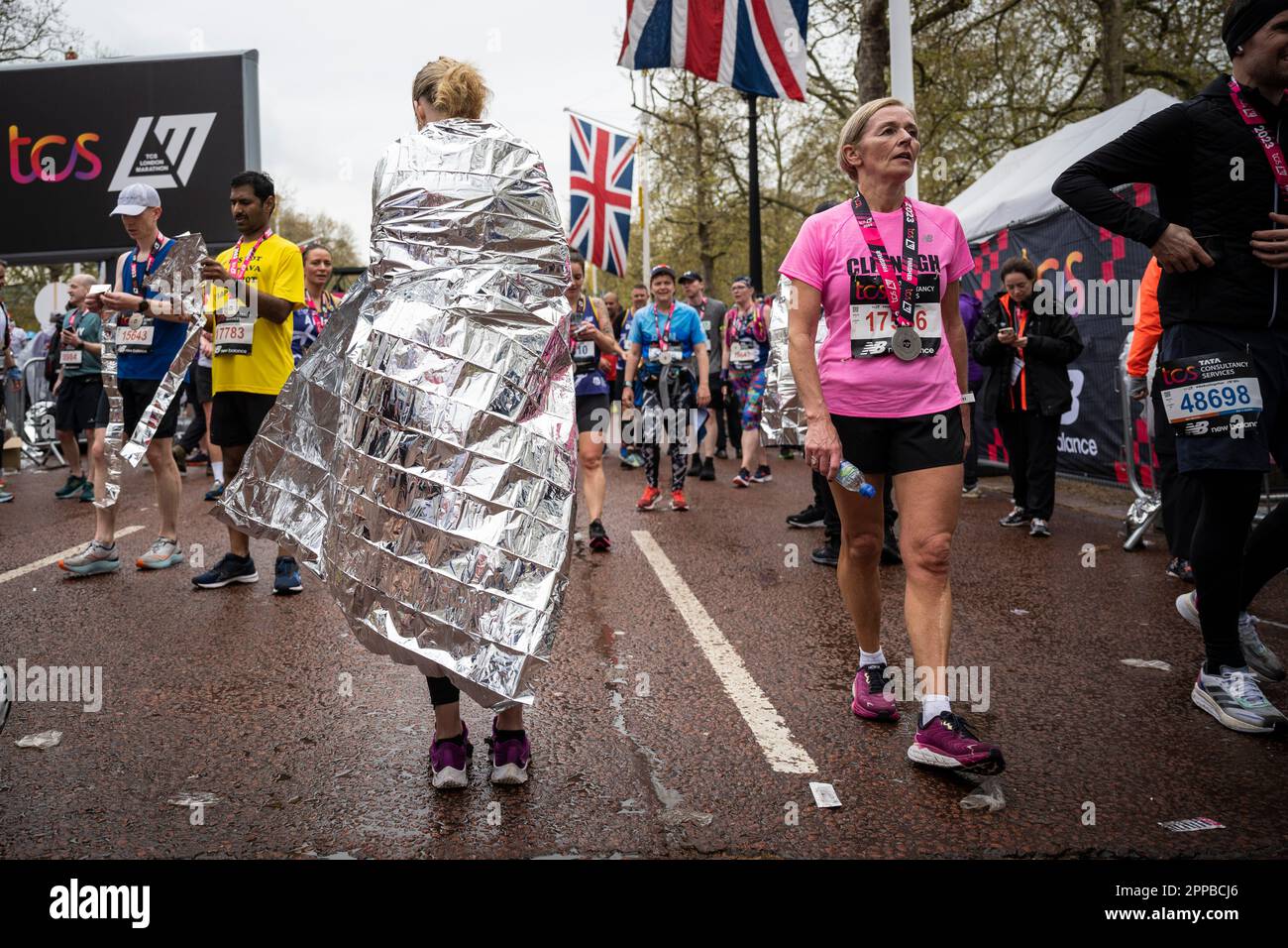 London, UK. 23 April 2023. A runner wrapped in a protective foil