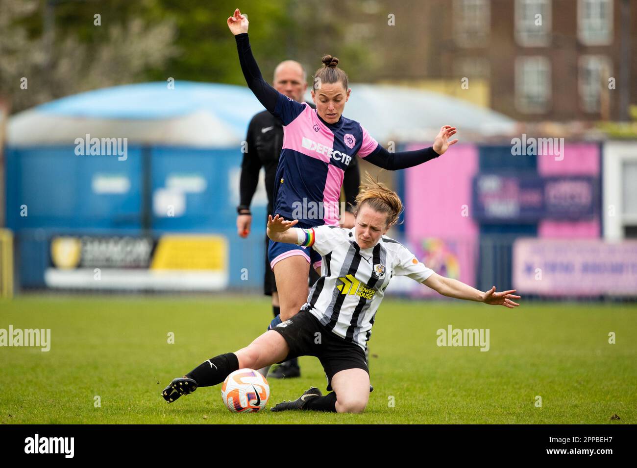 London, UK. 23rd April, 2023. Brittany Saylor (Dulwich Hamlet) and Elizabeth Adams (Dartford) in action during the London and South East Regional Womens Premier League game between Dulwich Hamlet and Dartford at Champion Hill Stadium. Credit: Liam Asman/Alamy Live News Stock Photo