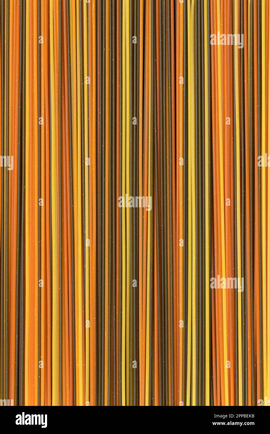 Spaghetti tricolore close up full frame as background Stock Photo - Alamy