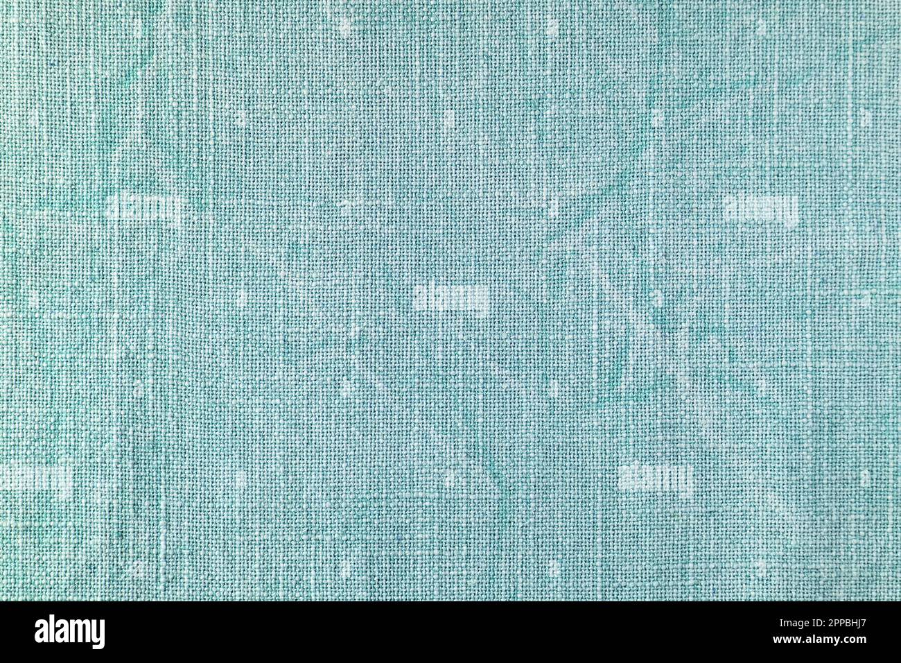 Natural turquoise linen fabric texture background. Flax cloth surface, tablecloth, upholstery, curtains textile. Top view, close up Stock Photo