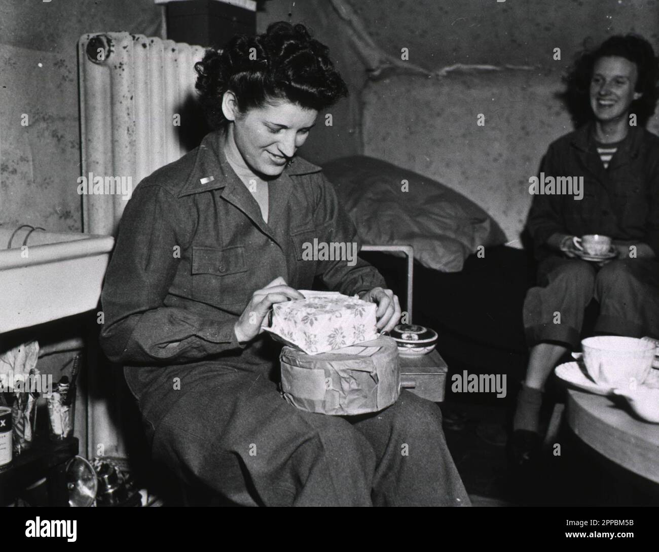 Army Nurse 1st Lt. Edna Parker Opens Christmas Packages Stock Photo - Alamy