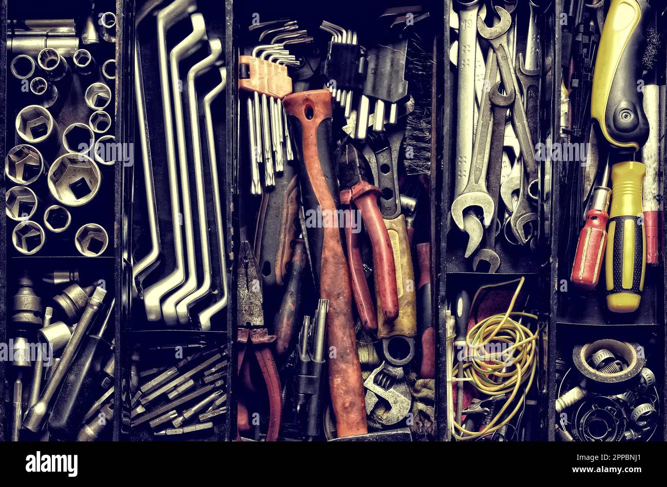 tools in a black metal box.. Toolset with interior compartments to keep wrenches, ring