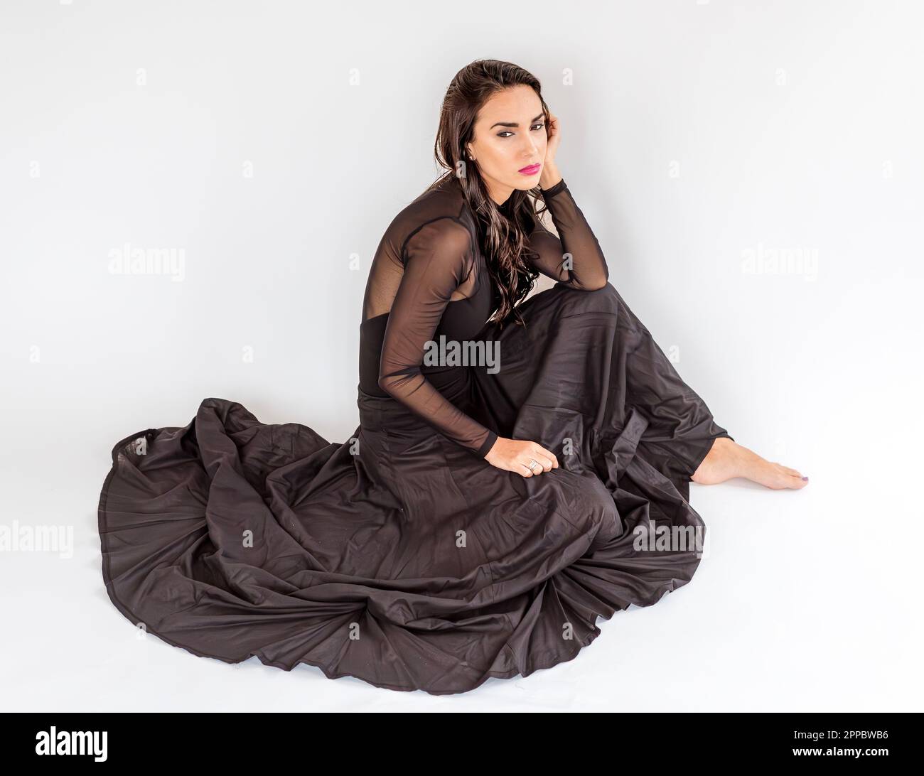 Black dress brunette hi-res stock photography and images - Alamy