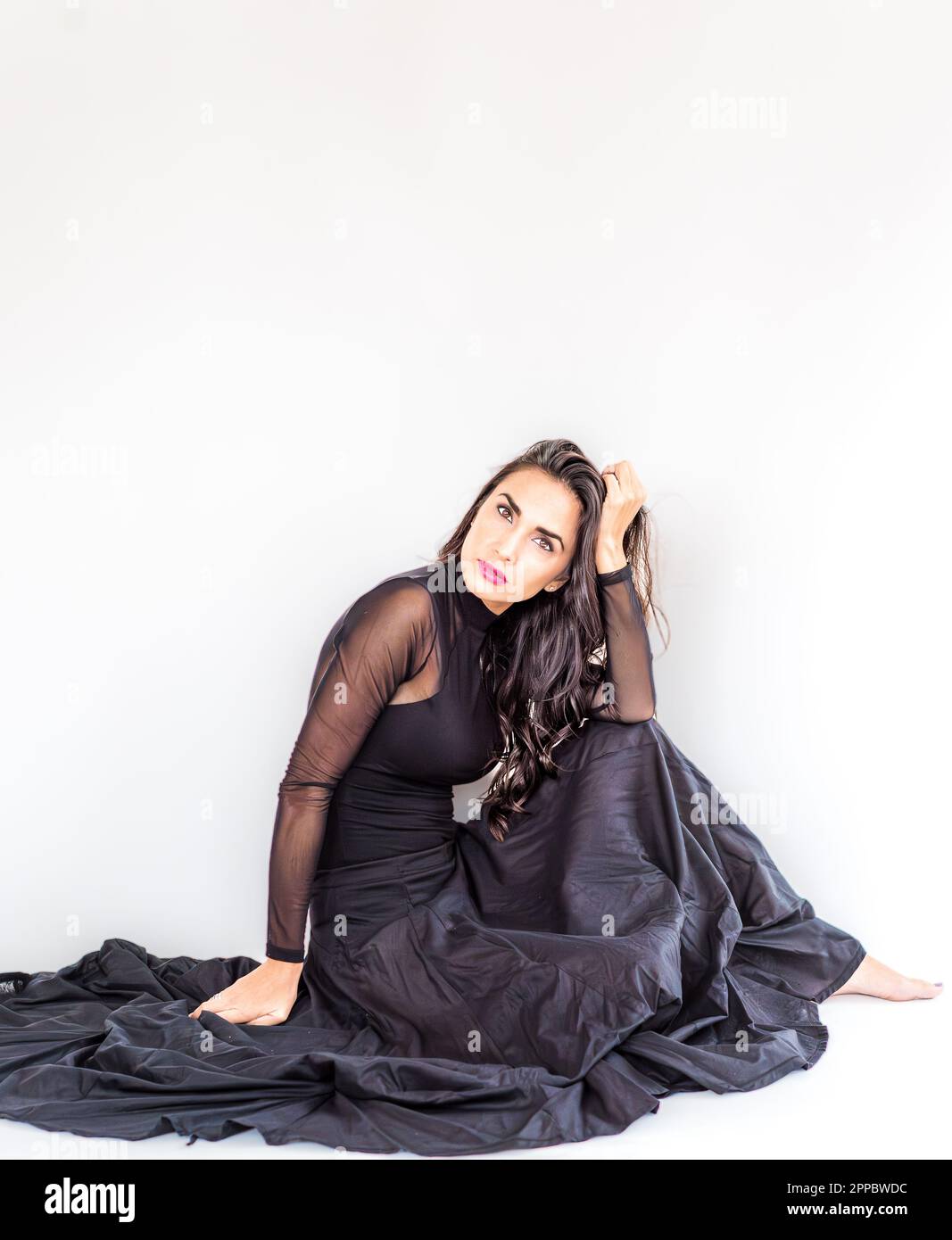 Black dress brunette hi-res stock photography and images - Alamy