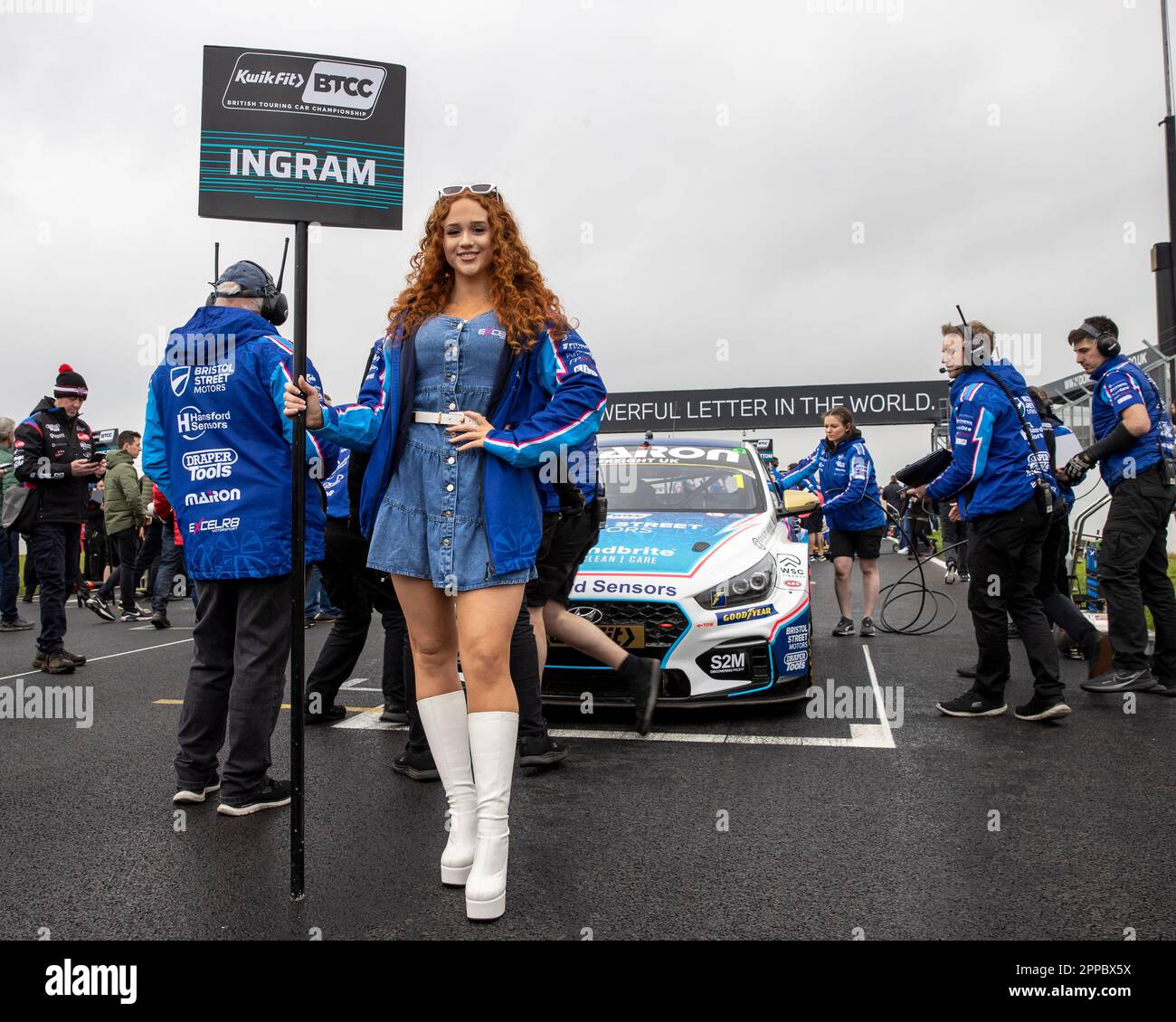 Donington Park, Castle Donington, Leicestershire, UK. 23rd April 2023; 23rd April 2023; Donington Park, Castle Donington, Leicestershire, England: Kwik Fit British Touring Car Championship; The grid girl of Tom Ingham in his Bristol Street Motors with ExcelR8 Hyundai i30N Credit: Action Plus Sports Images/Alamy Live News Stock Photo