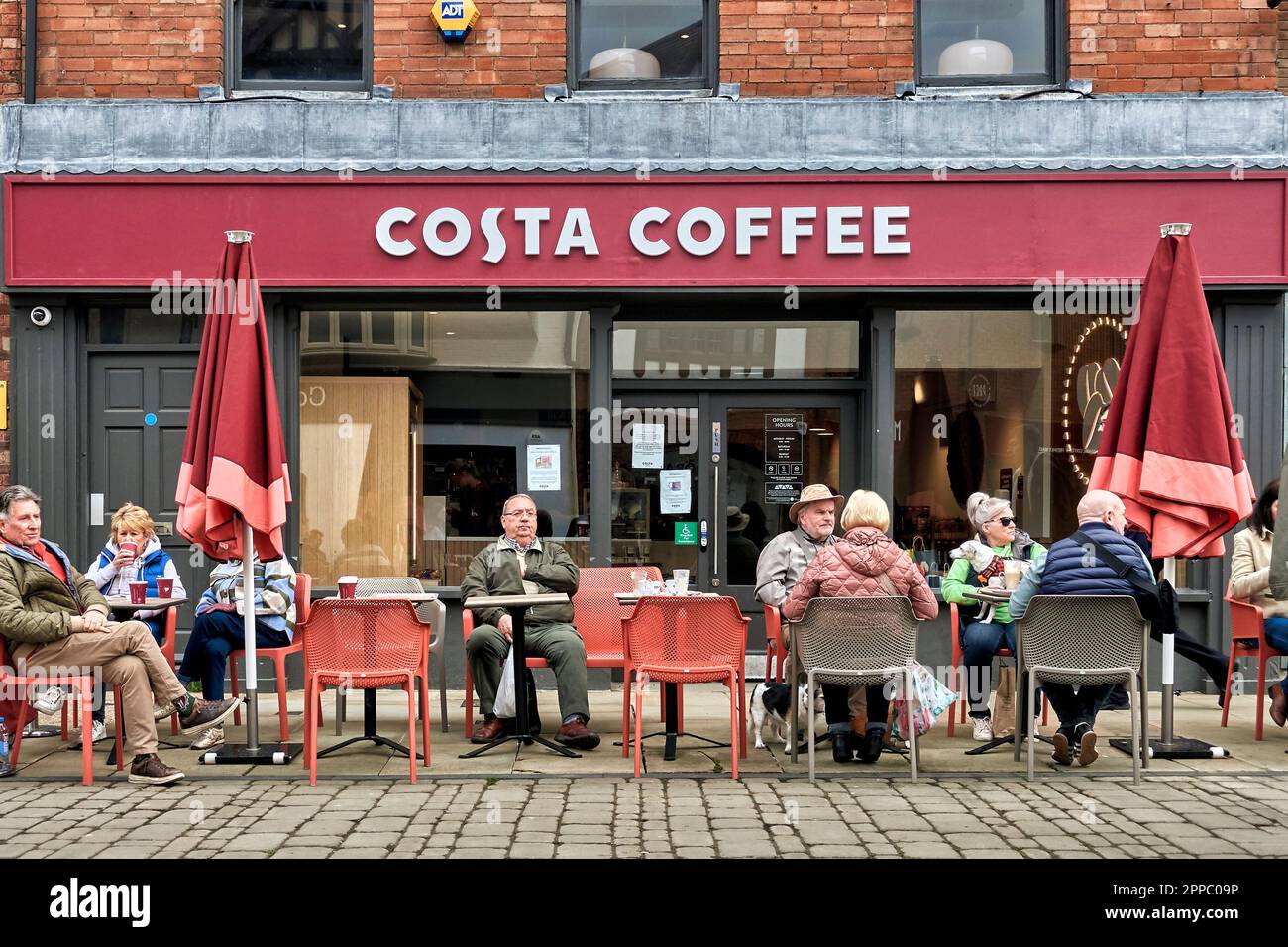 Costa Coffee UK pavement cafe. People drinking coffee at Costa Coffee
