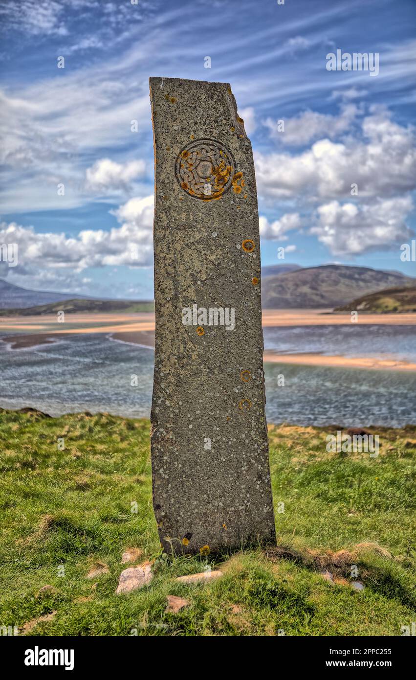 The Keoldale Standing Stone at Durness. A standing stone by the viewpoint, overlooking the Kyle of Durness with Celtic inscriptions. Stock Photo