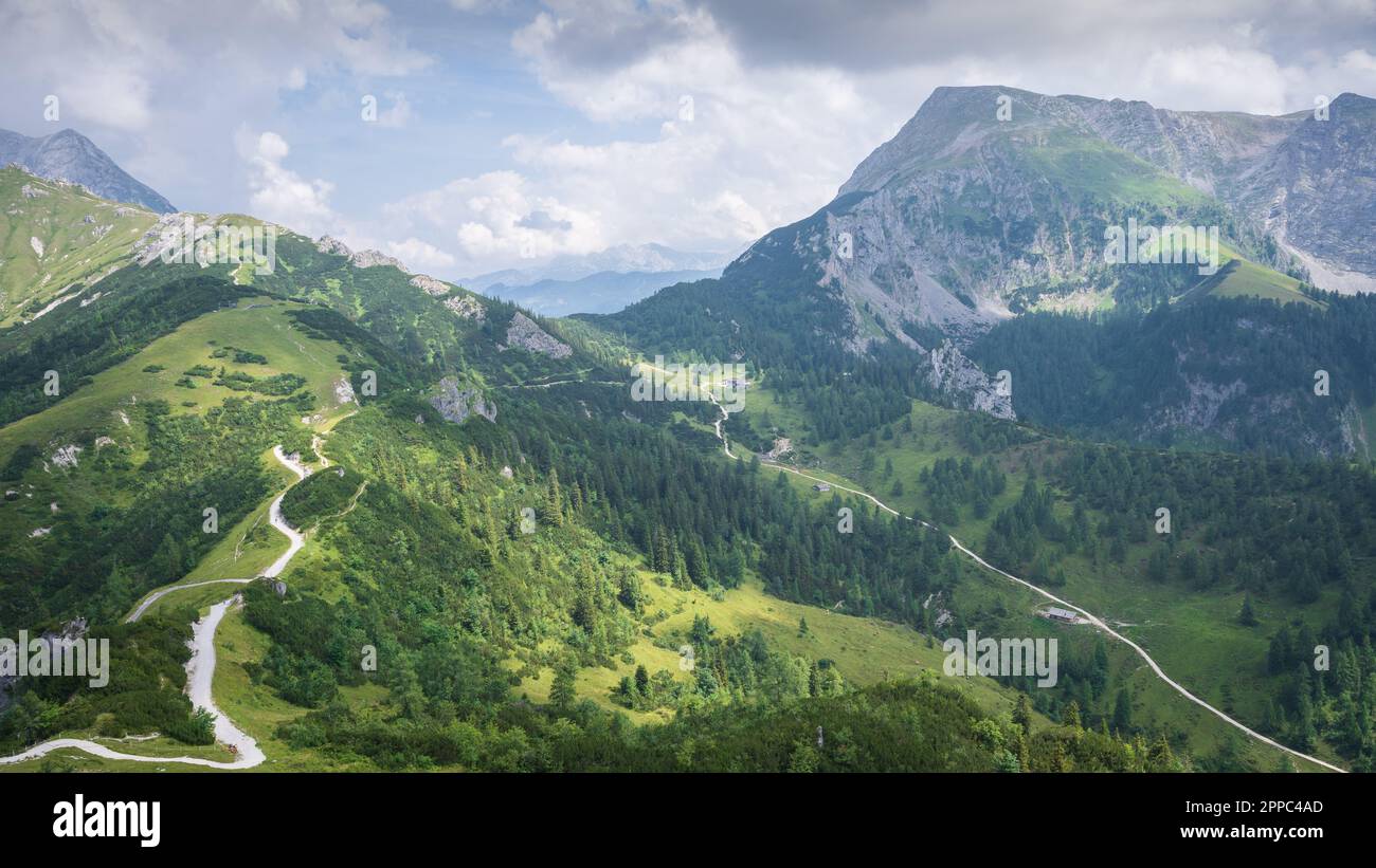 Green and grassy alpine landscape with peaks, trails and huts , Jenner ...