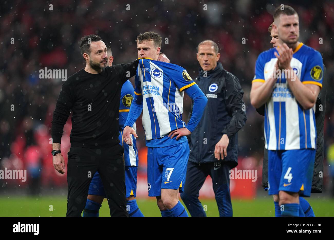 Brighton and Hove Albion manager Roberto De Zerbi comforts Solly March after missing a penalty in the shootout following the Emirates FA Cup semi-final match at Wembley Stadium, London. Picture date: Sunday April 23, 2023. Stock Photo