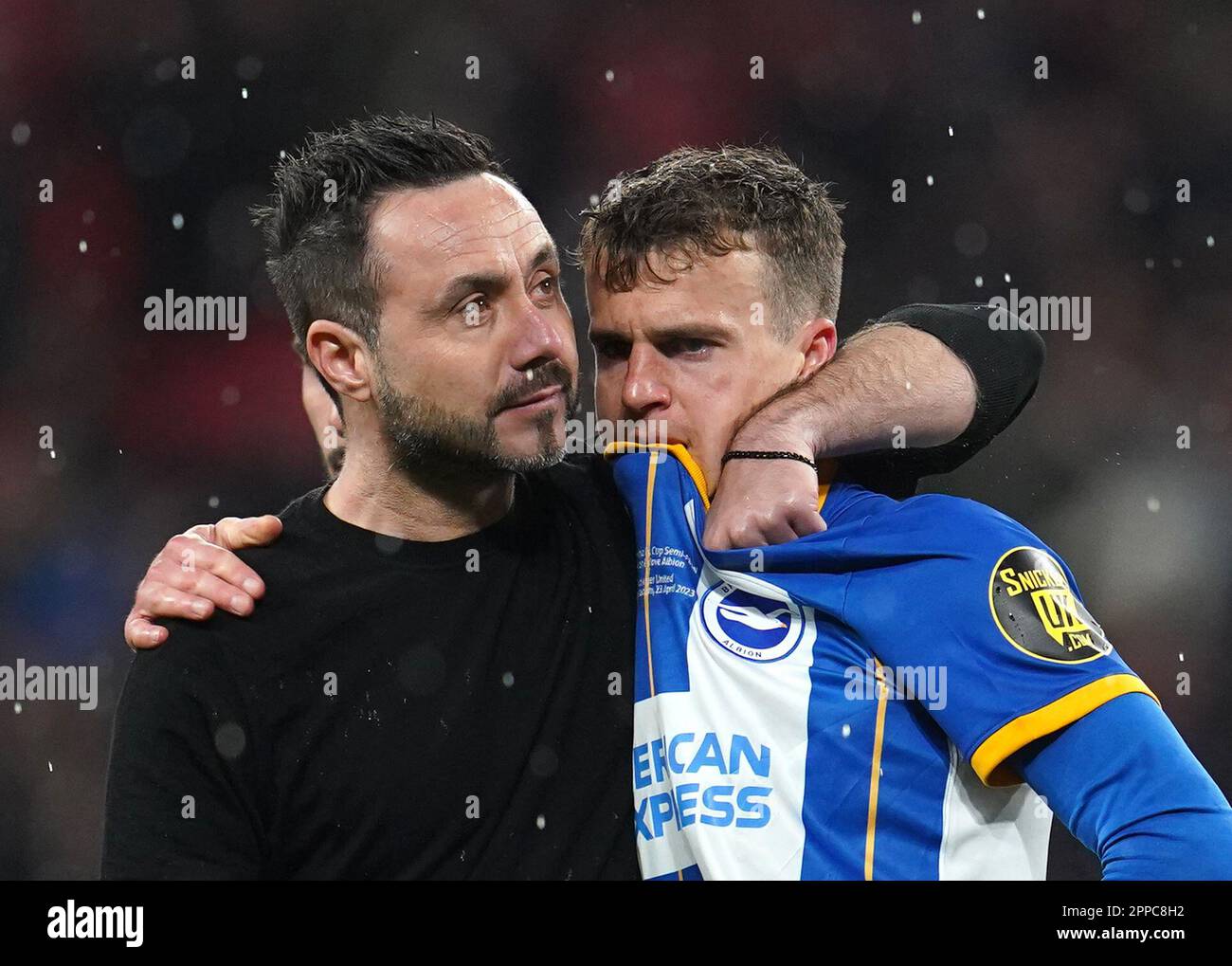 Brighton and Hove Albion manager Roberto De Zerbi comforts Solly March after missing a penalty in the shootout following the Emirates FA Cup semi-final match at Wembley Stadium, London. Picture date: Sunday April 23, 2023. Stock Photo