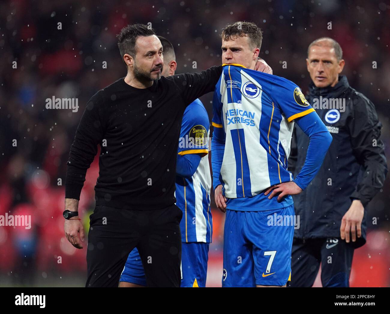 Brighton and Hove Albion manager Roberto De Zerbi comforts Solly March after missing a penalty in the shootout following the Emirates FA Cup semi-final match at Wembley Stadium, London. Picture date: Sunday April 23, 2023. Stock Photo