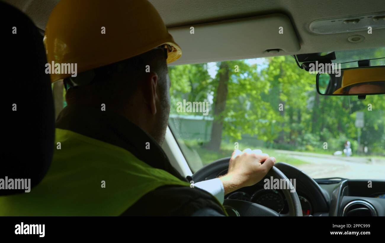 Man in hard hat sitting hi-res stock photography and images - Alamy