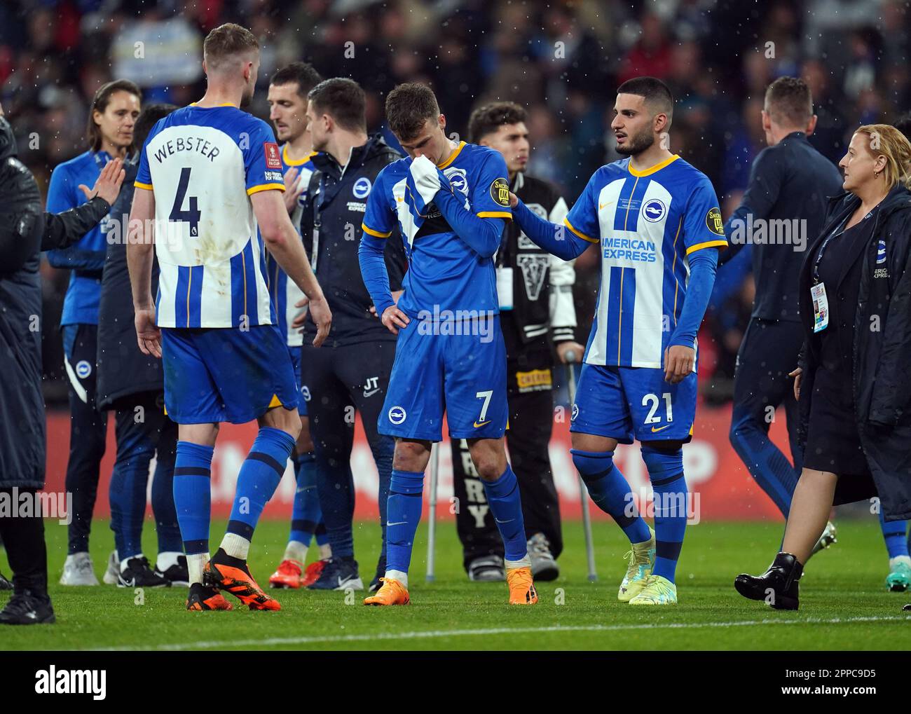 Brighton and Hove Albion's Solly March (centre) after missing a penalty in the shoot-out following during the Emirates FA Cup semi-final match at Wembley Stadium, London. Picture date: Sunday April 23, 2023. Stock Photo