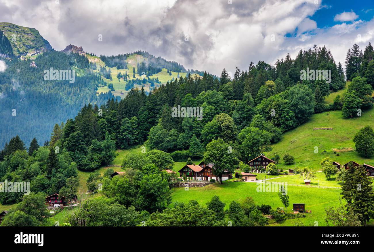 Townscape of village of Wengen on the edge of Lauterbrunnen Valley. Traditional local houses in Wengen village in the Interlaken district in the Bern Stock Photo