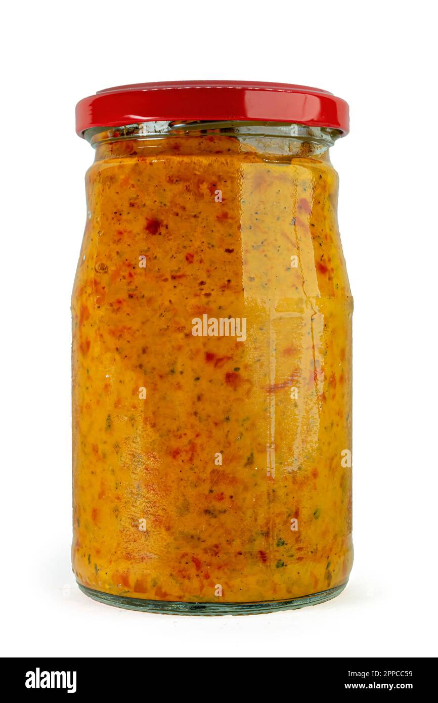 Ajvar roasted red peppers spread in a Jar isolated on white background