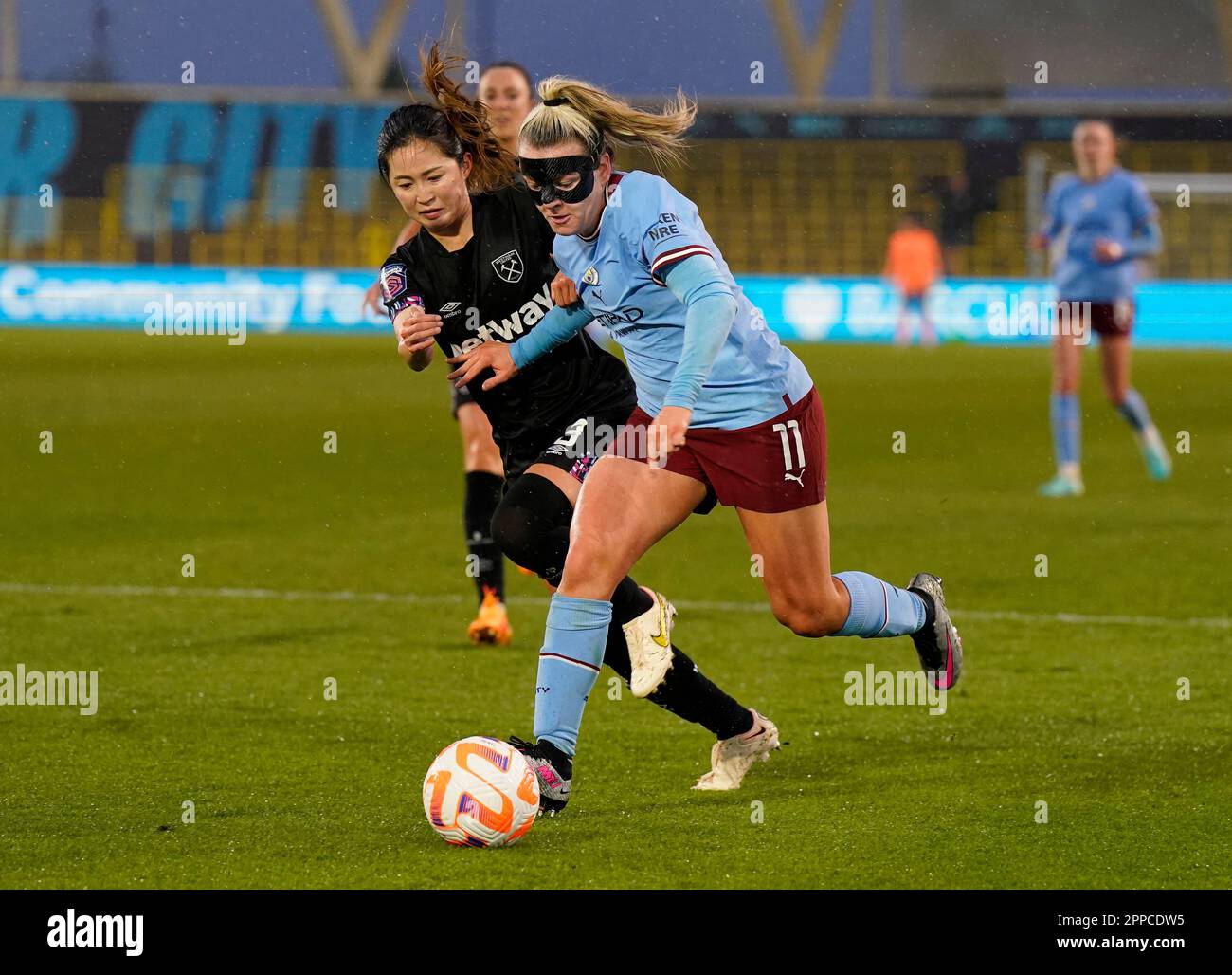 Manchester, UK. 23rd Apr, 2023. Lauren Hemp of Manchester City (R) is challenged by Risa Shimizu of West Ham United during the The FA Women's Super League match at the Academy Stadium, Manchester. Picture credit should read: Andrew Yates/Sportimage Credit: Sportimage Ltd/Alamy Live News Stock Photo