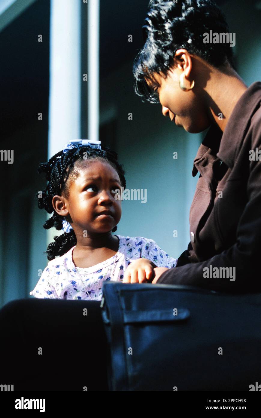 African-American mother bonding with her three year old daughter Stock Photo