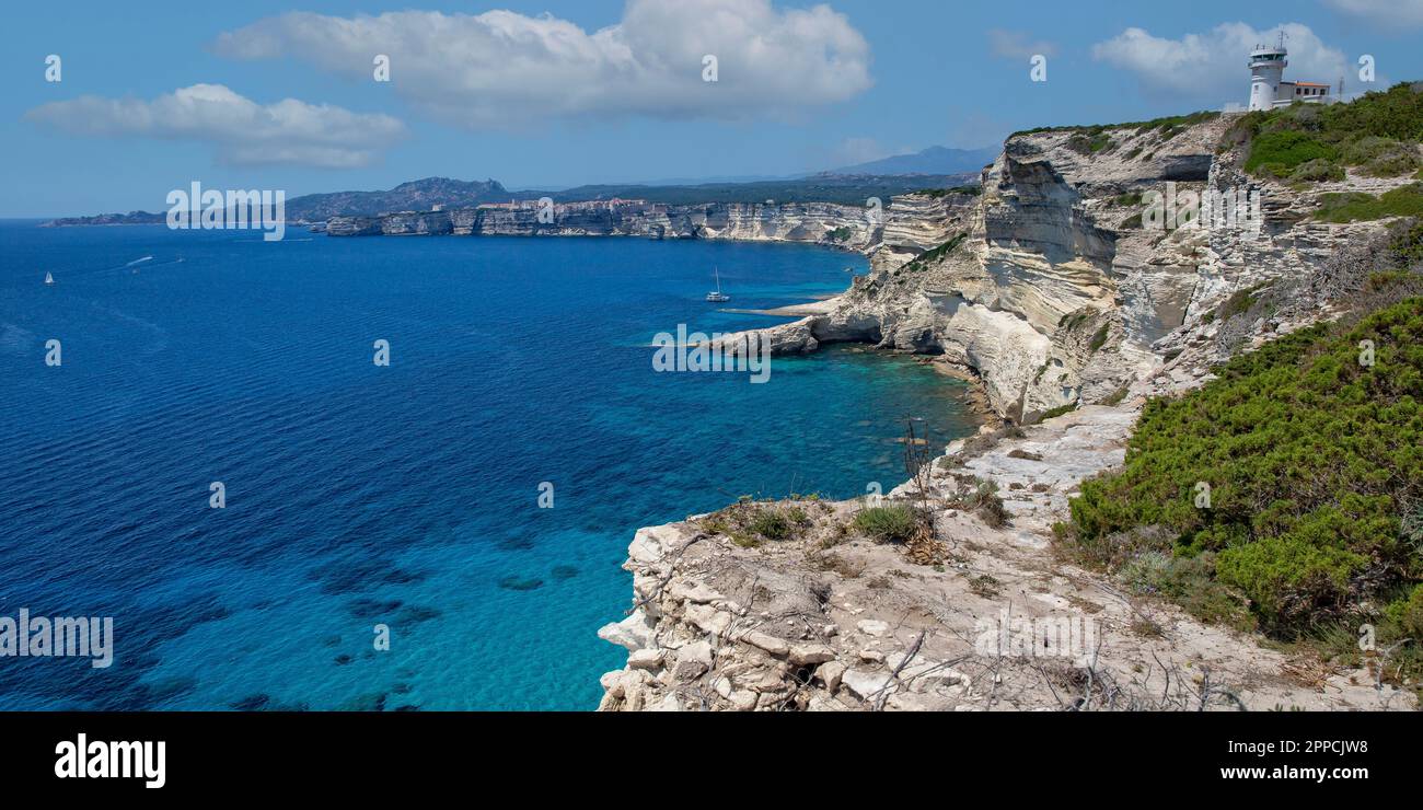 The famous rugged chalk cliffs and turquoise blue sea coast at Bonifacio, Capo Pertusato, Corsica island, France Stock Photo