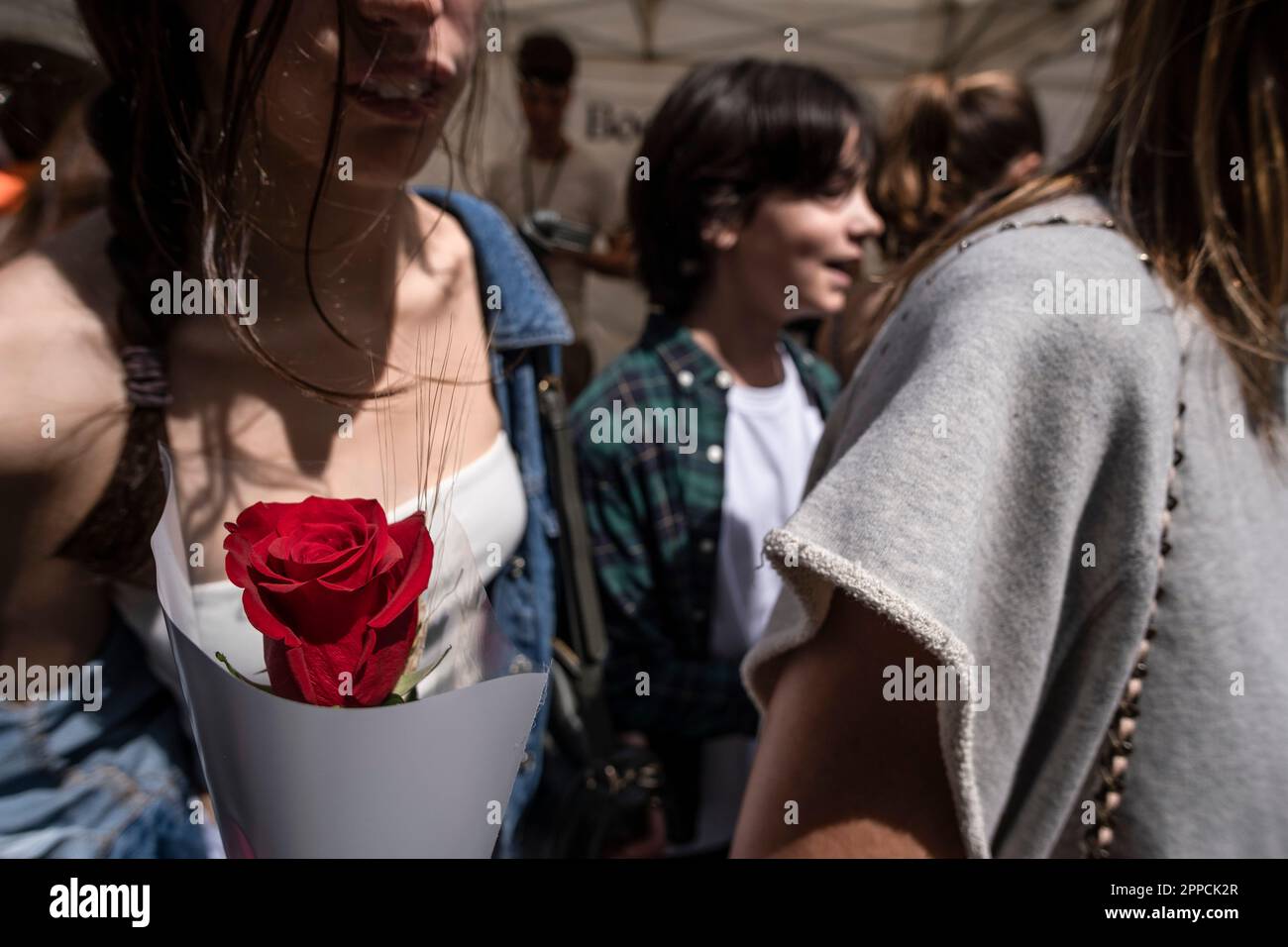 Barcelona, Spain. 23rd Apr, 2023. A young woman is seen carrying a red ...