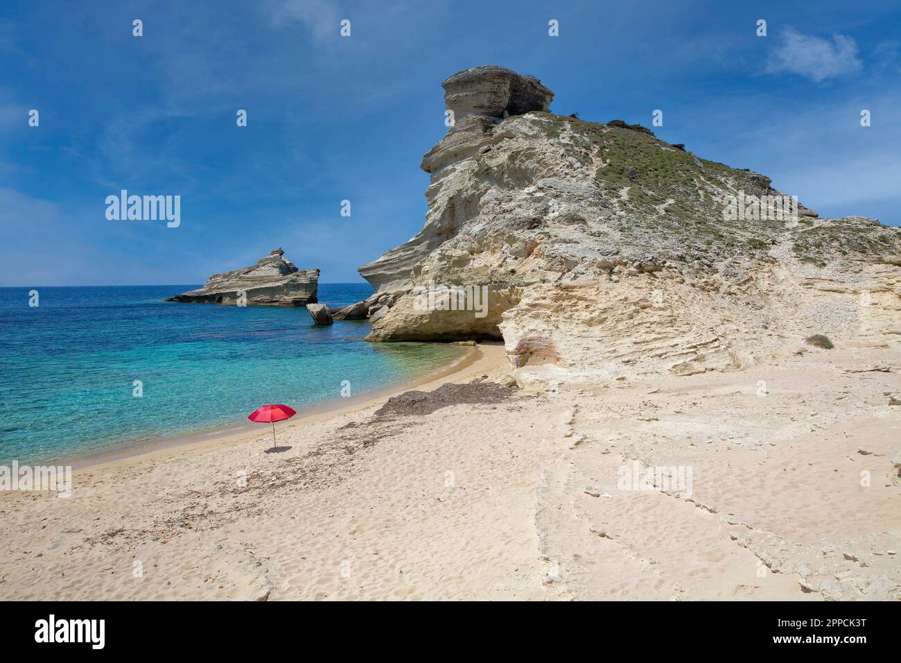 Beautiful sandy beach Plage de Saint Antoine with white cliffs and blue Mediterranean sea, Capo Pertusato, Bonifacio, Corsica island, France Stock Photo