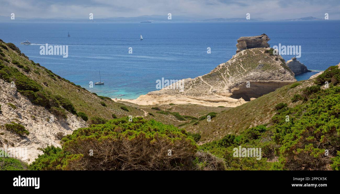 View of the beautiful Saint Antoine beach with white cliffs and blue Mediterranean sea, Capo Pertusato, Bonifacio, Corsica island, France Stock Photo