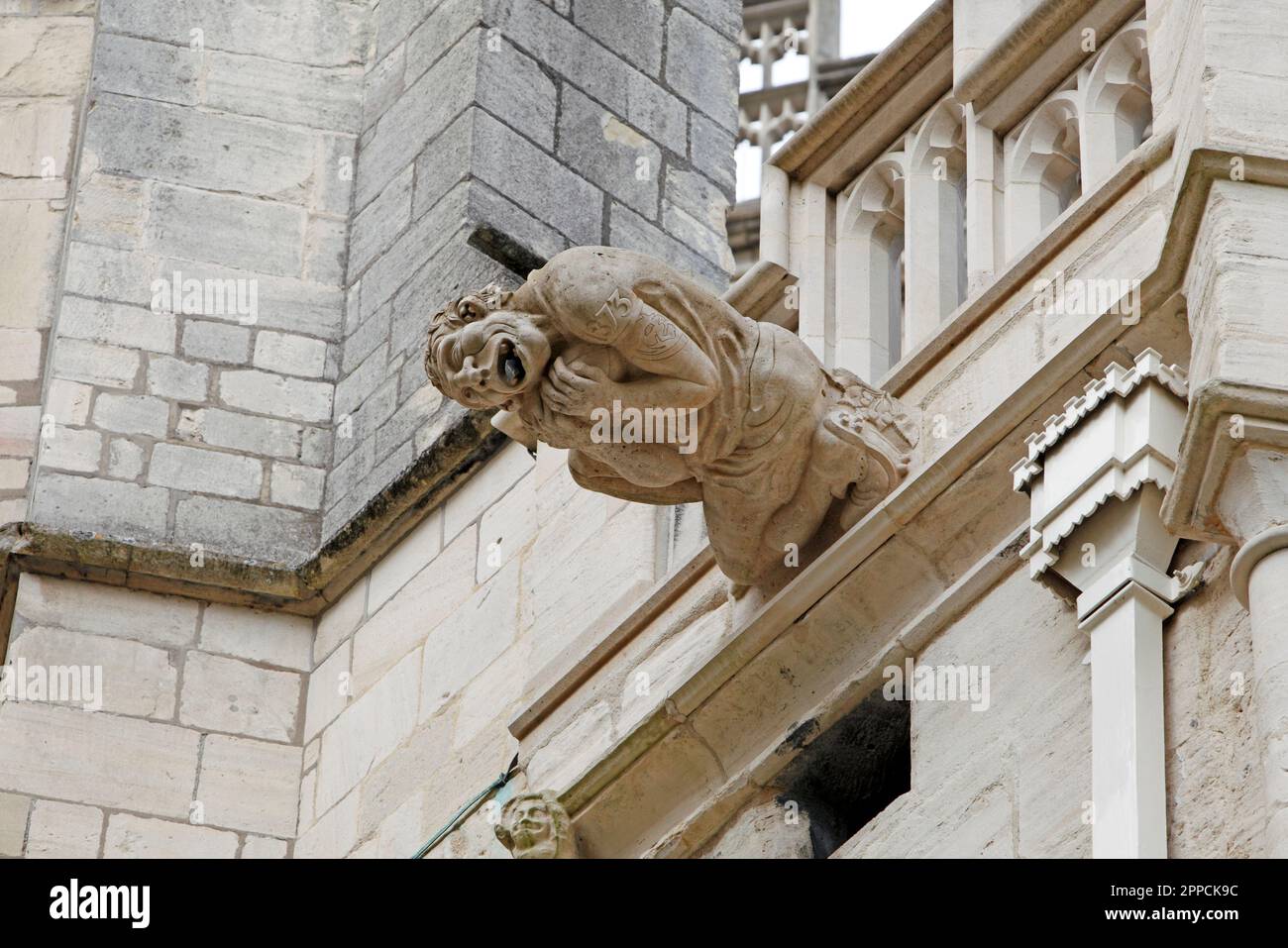 Rugby player. Modern Gargoyle or grotesque on Gloucester Cathedral ...