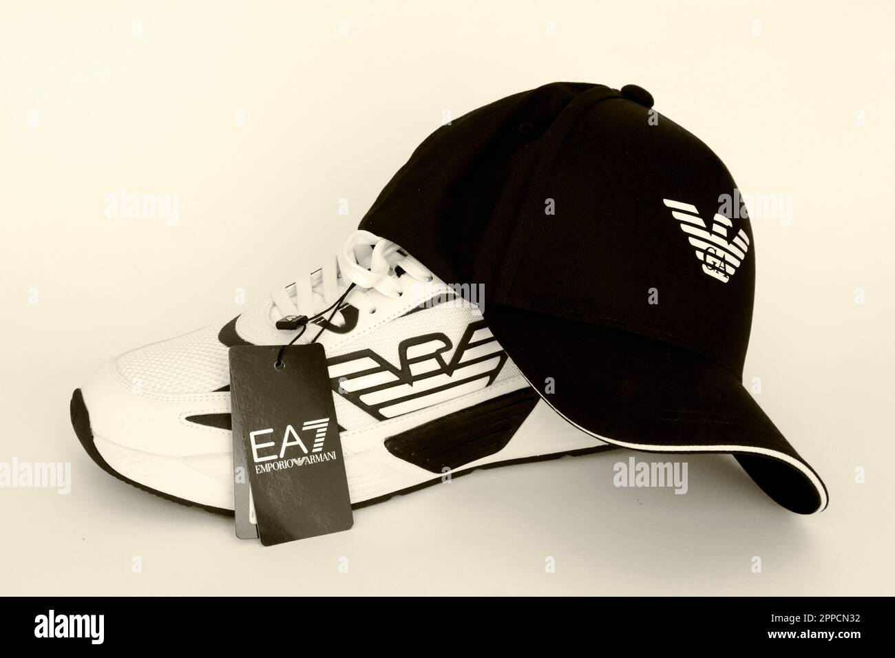 EA7 EMPORIO ARMANI Sneakers and Cap. EA7 is an Italian luxury fashion house  brand of GIORGIO ARMANI S.p.A. - Italy Stock Photo - Alamy