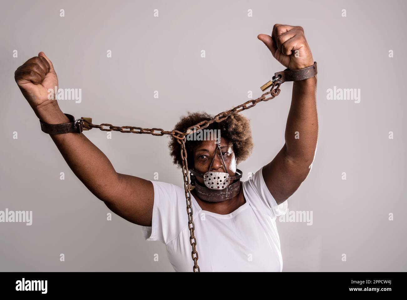 Woman Trapped In Chains. Photography Symbolizing Captivity Or Violence  Against Woman. Stock Photo, Picture and Royalty Free Image. Image 146416623.