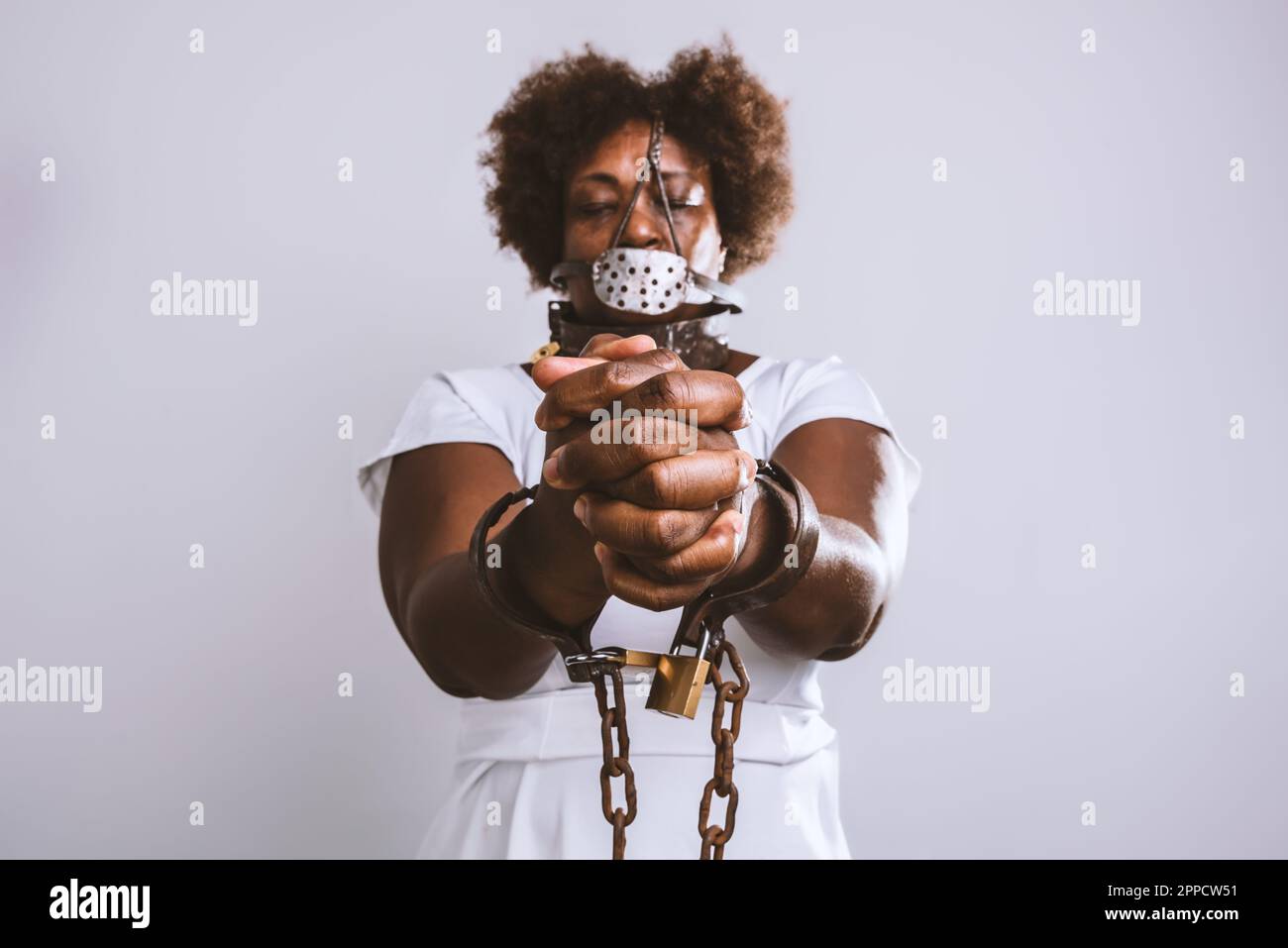 Woman Trapped In Chains. Photography Symbolizing Captivity Or Violence  Against Woman. Stock Photo, Picture and Royalty Free Image. Image 146416623.