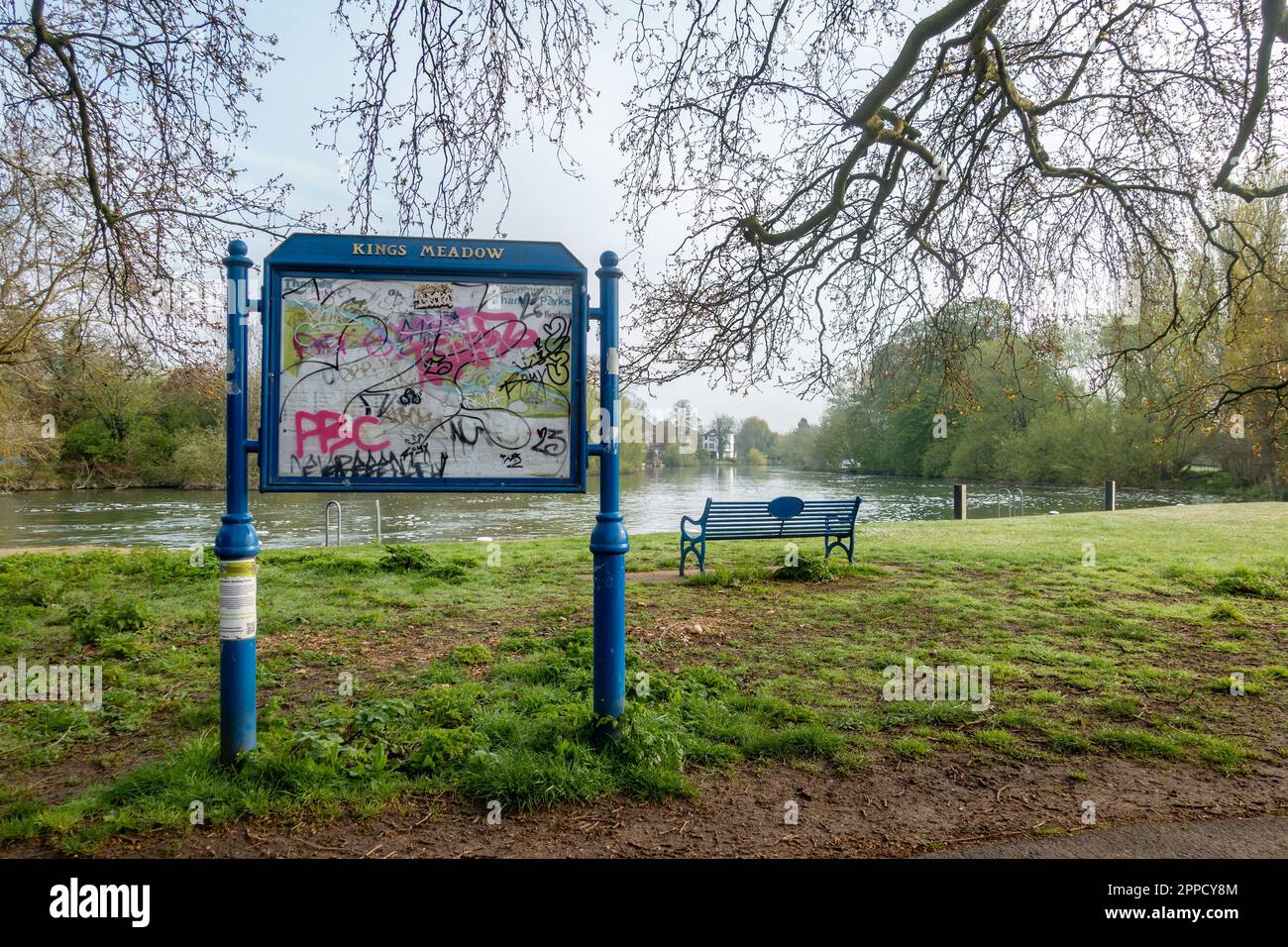 An information board in Kings Meadow park in Reading, UK situated next to The River Thames is vandalised with graafitti Stock Photo