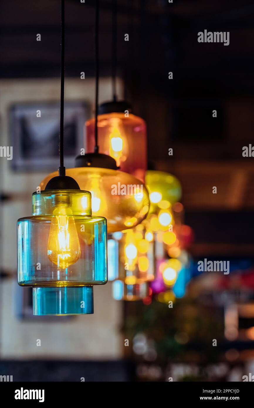 Colorful round stylish lamp shades hang from ceiling Stock Photo Alamy