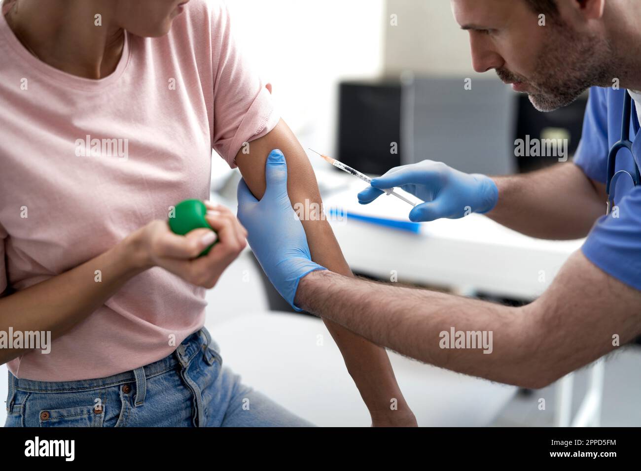 Doctor giving woman injection hi-res stock photography and images - Alamy