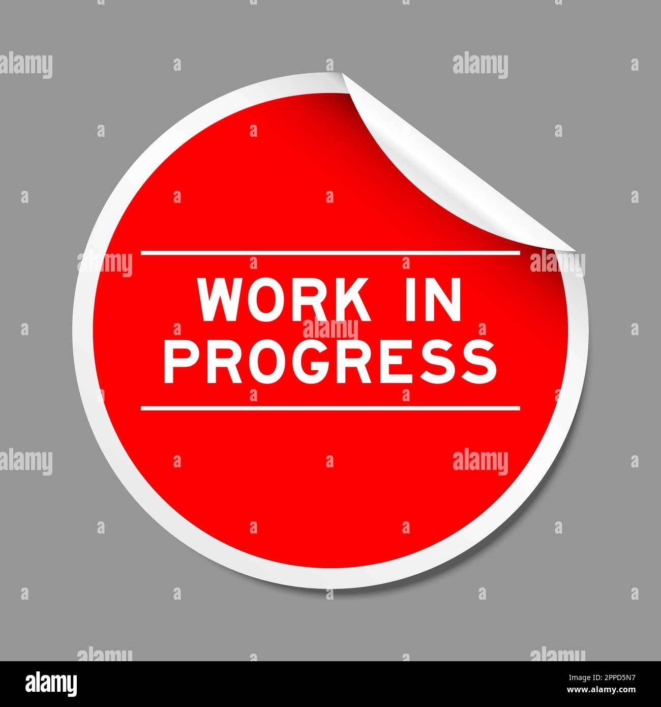 Red color peel sticker label with word work in progress on gray ...