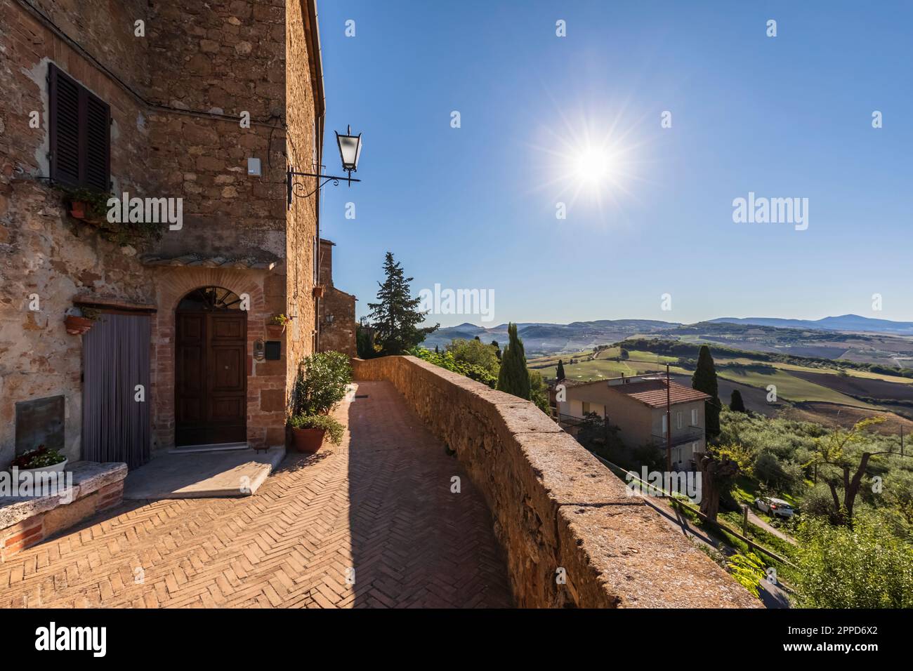 Italy, Tuscany, Pienza, Sun shining over edge of historic town Stock Photo