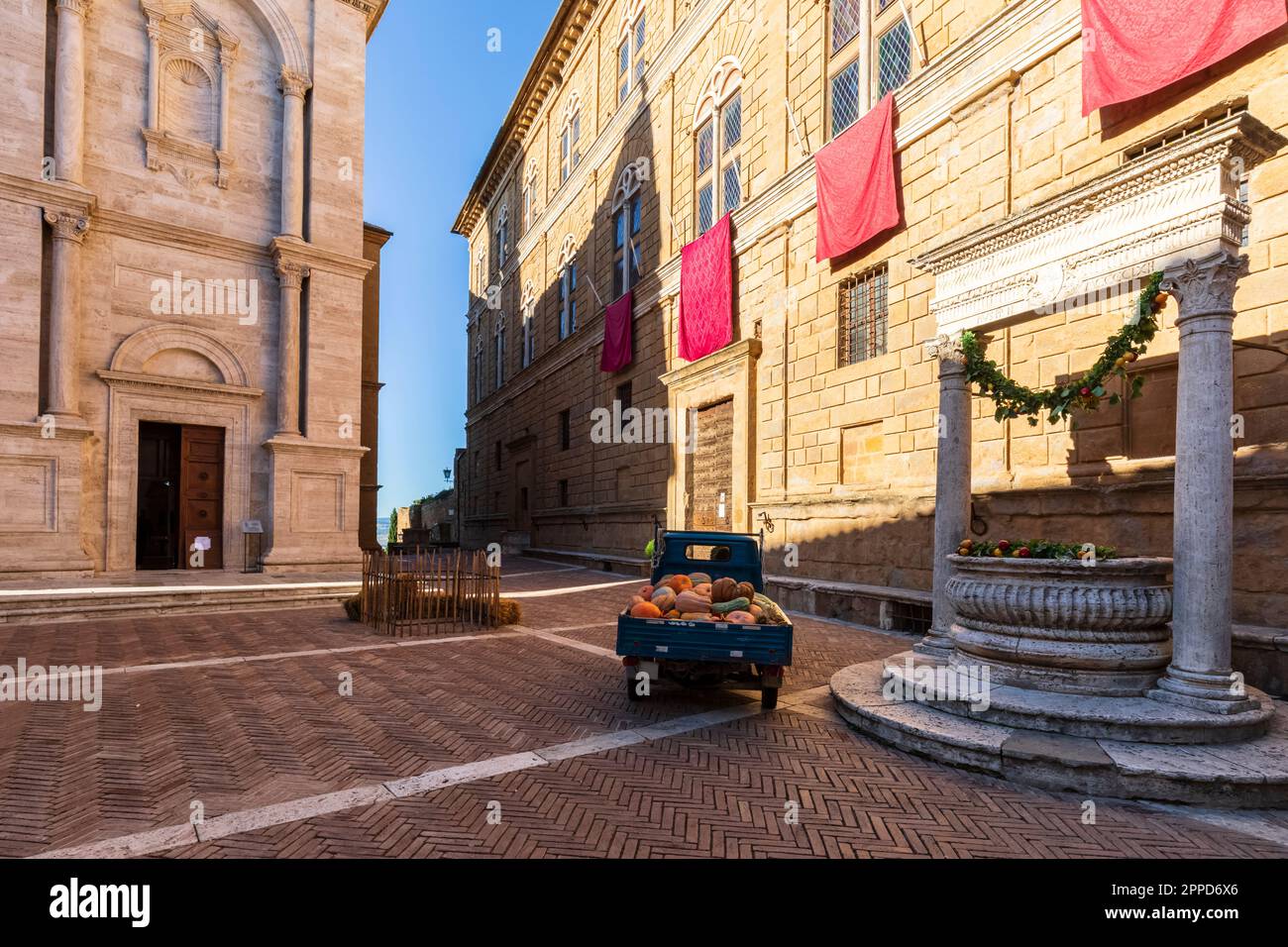Italy, Tuscany, Pienza, Piaggio ape parked in front of Fontana del Palazzo Piccolomini Stock Photo