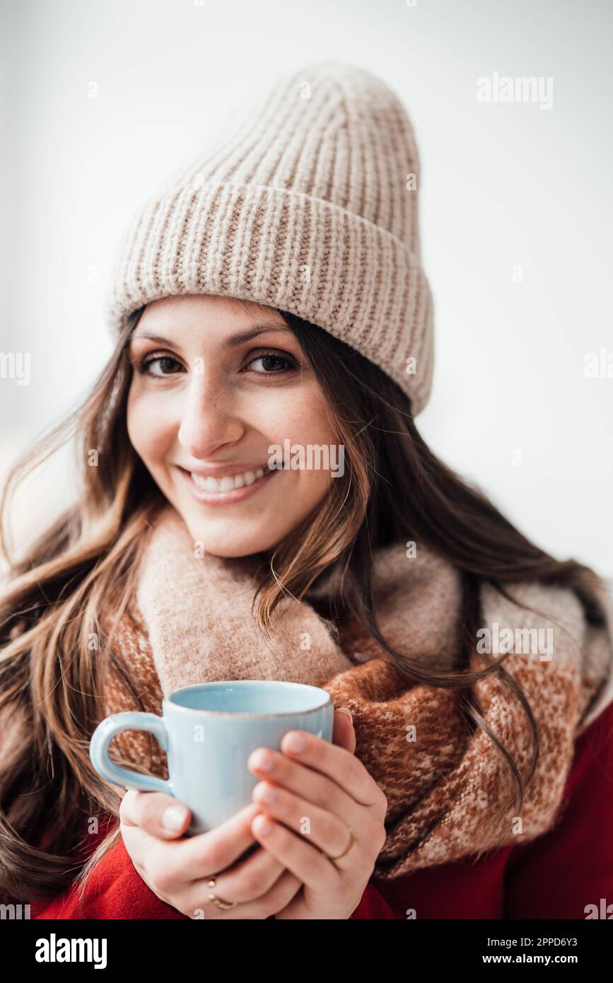 Young woman woolly hat smile hi-res stock photography and images - Alamy
