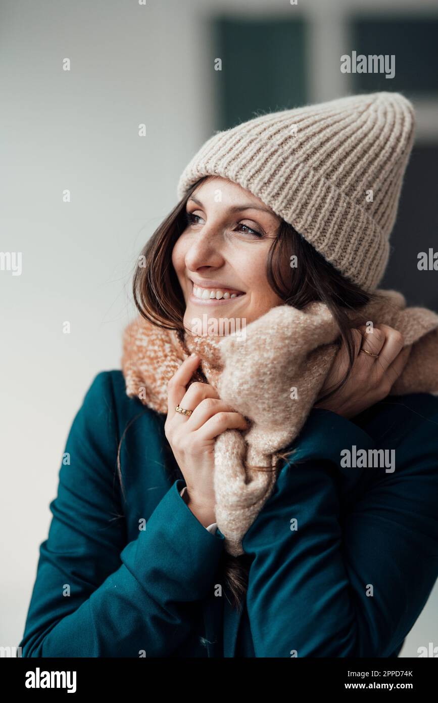 Happy young woman wearing knit hat Stock Photo