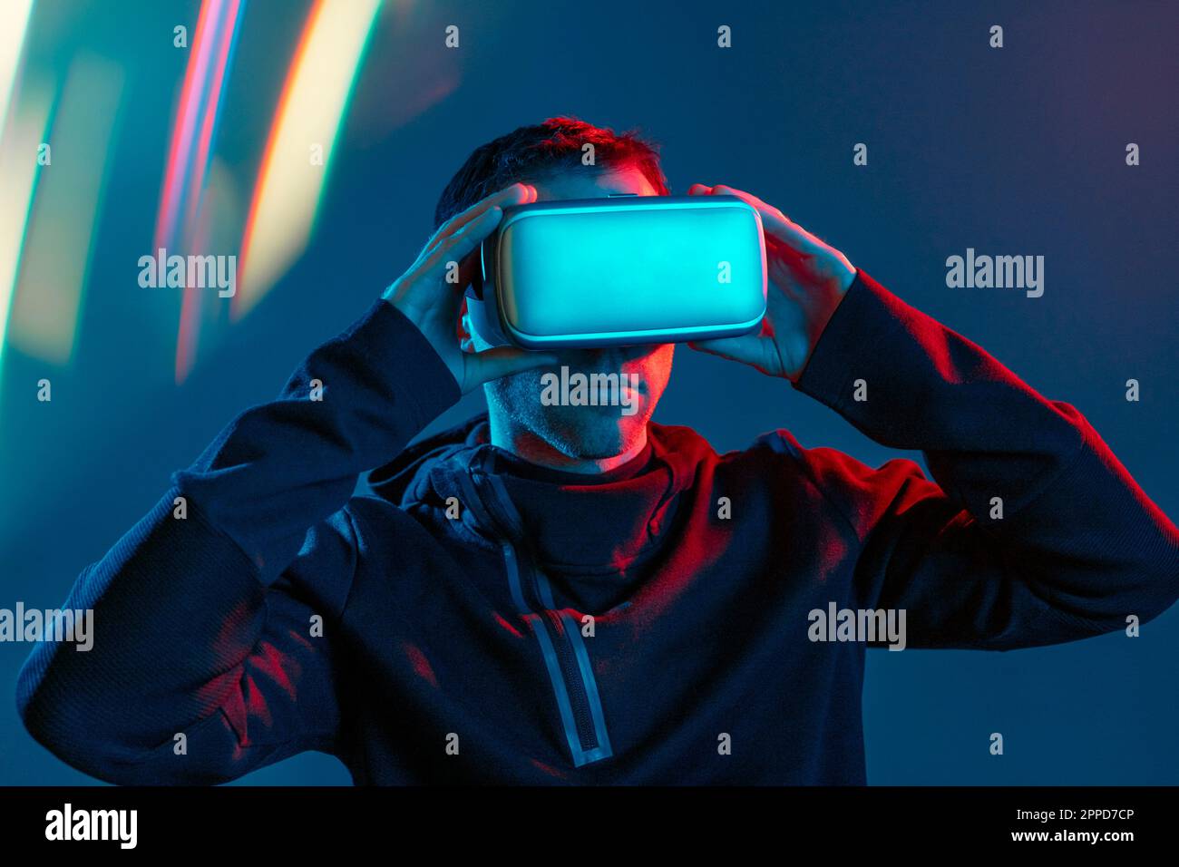 Man wearing virtual reality simulators Stock Photo - Alamy