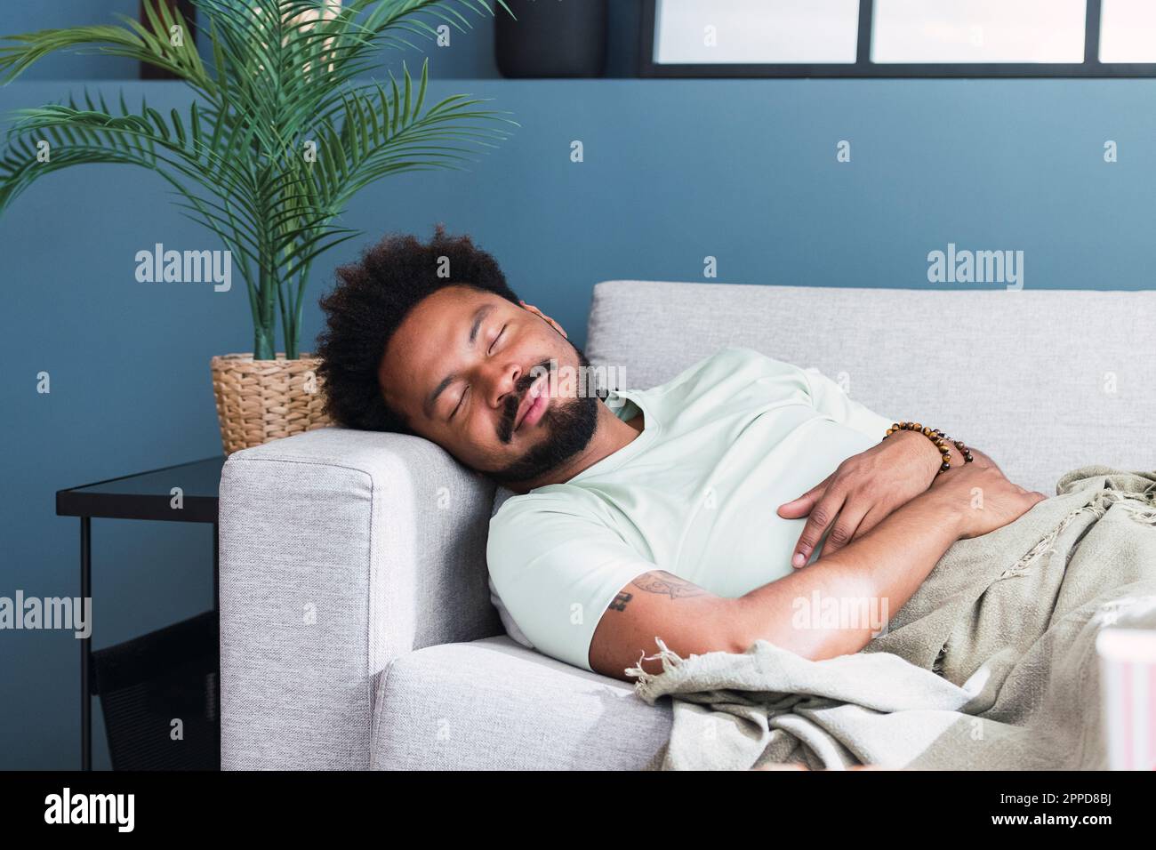 Man sleeping on sofa at home Stock Photo Alamy