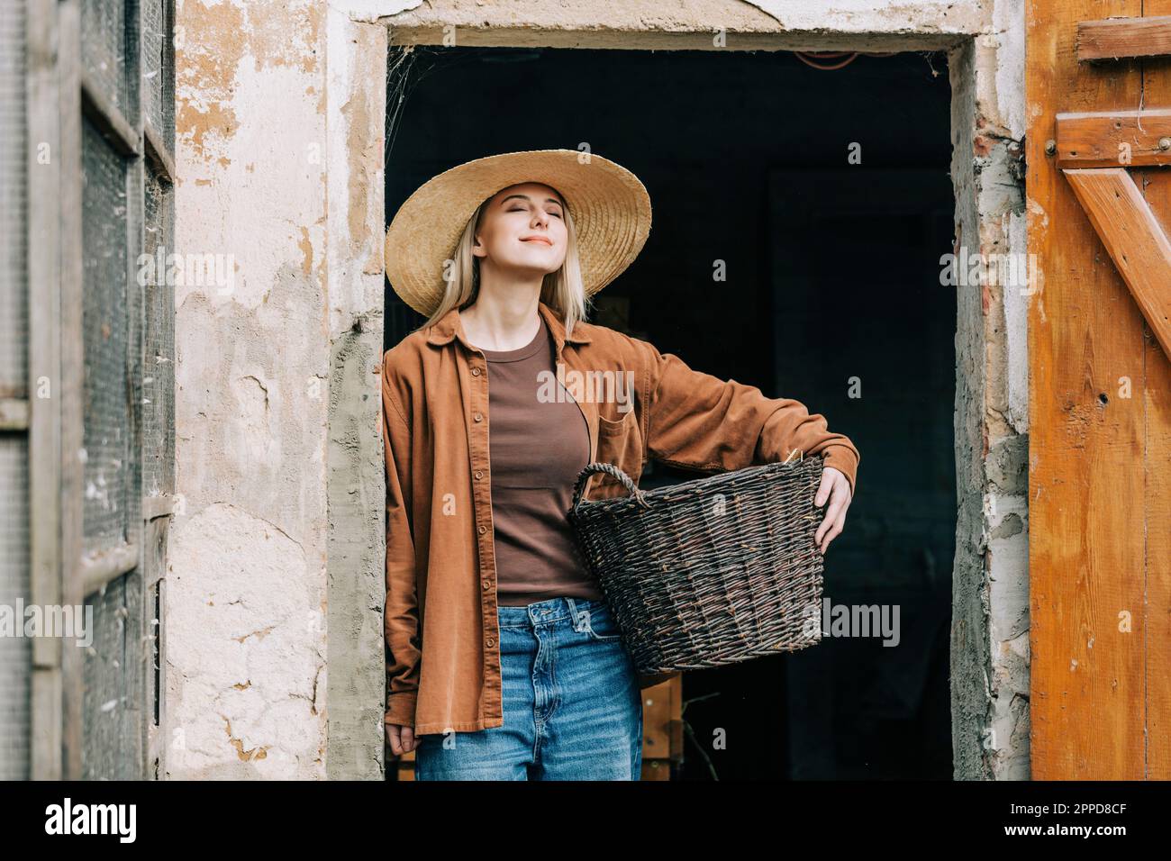 Woman farmer holding basket hi-res stock photography and images - Alamy