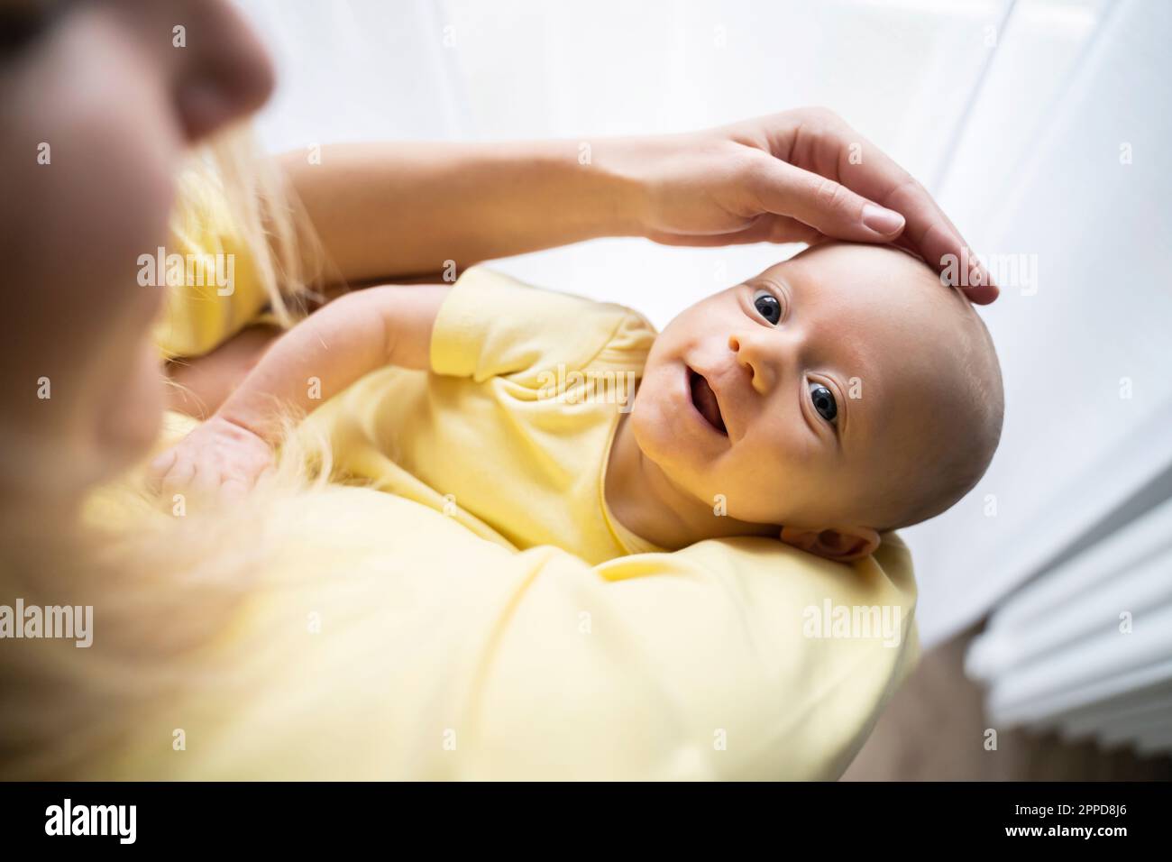 Mother stroking of cute baby boy Stock Photo