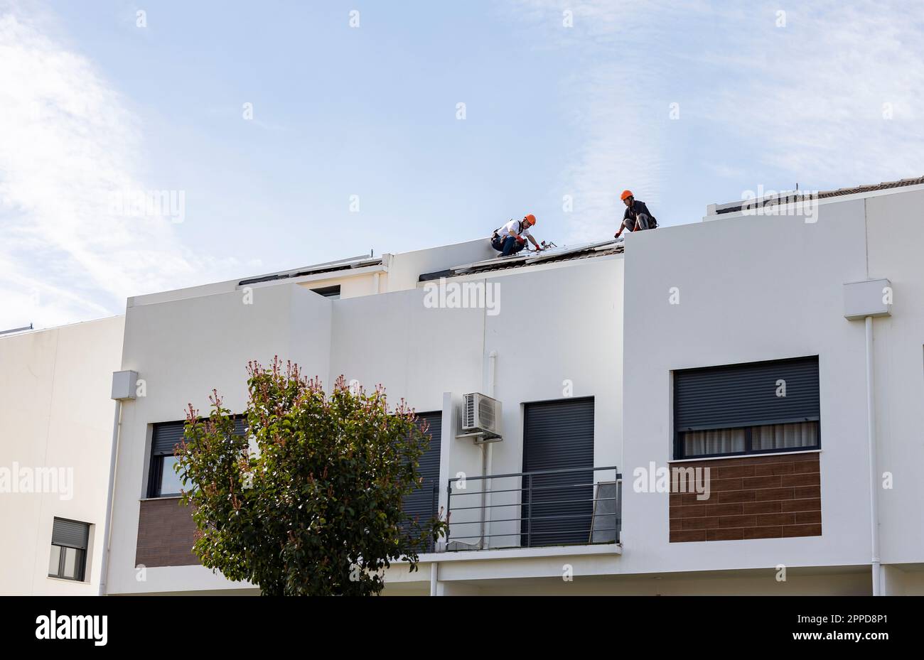 Male technicians installing solar cell hi-res stock photography and ...