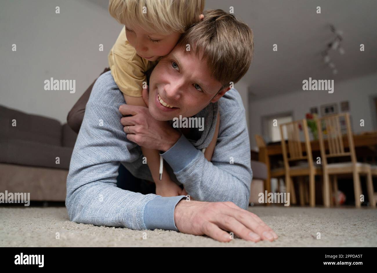 Happy father with boy spending time together at home Stock Photo