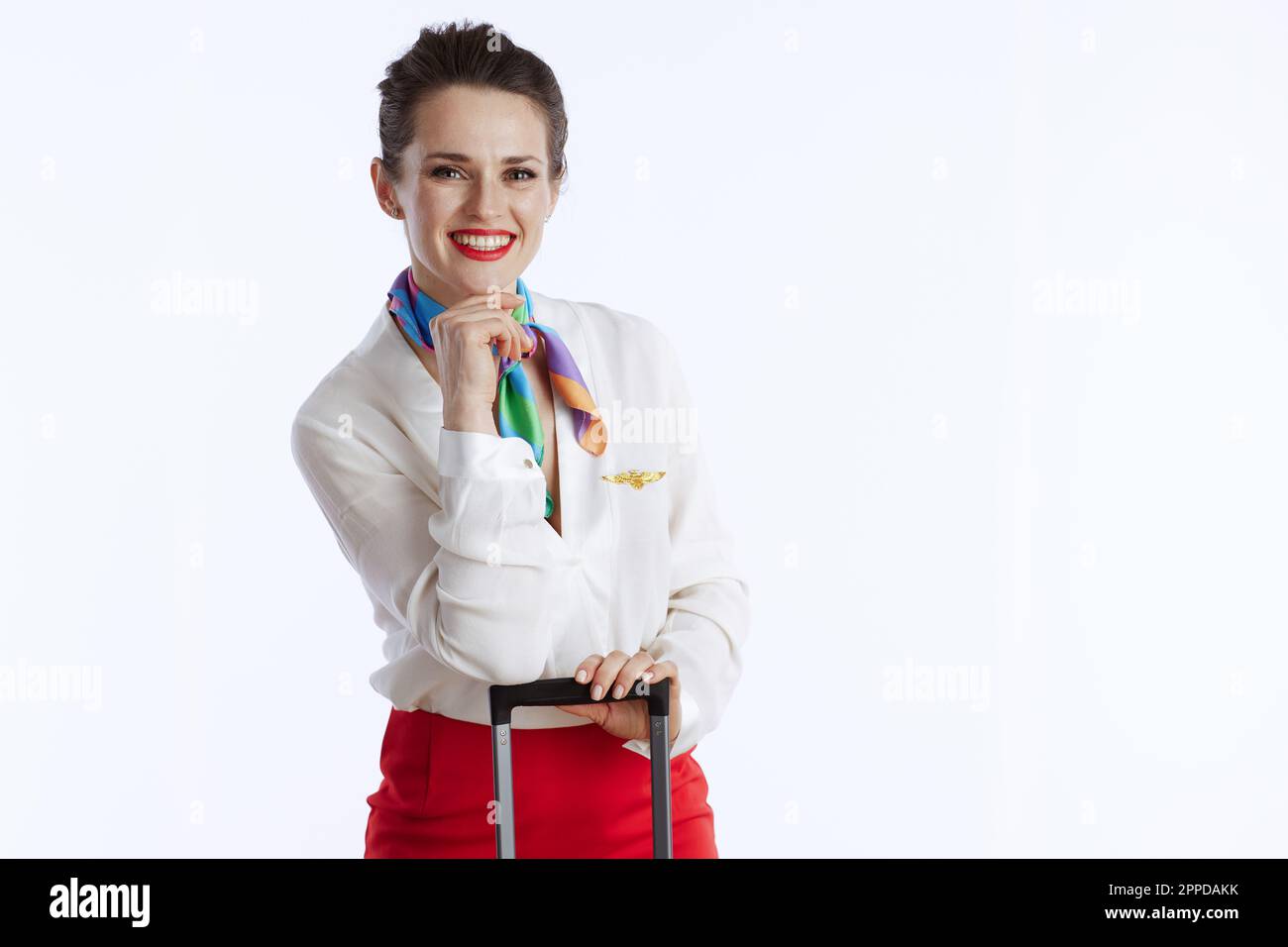smiling elegant female flight attendant isolated on white background in