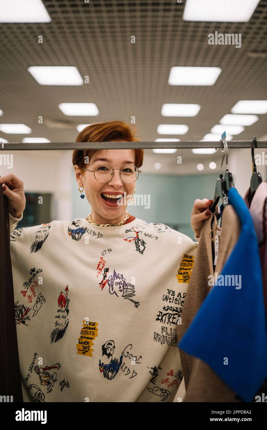She Has A Rack Clothing rack woman hi-res stock photography and images - Alamy