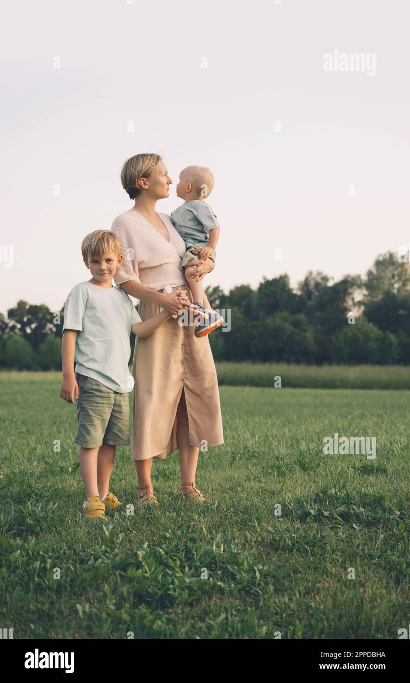 Mother holding sons hand hi-res stock photography and images - Alamy