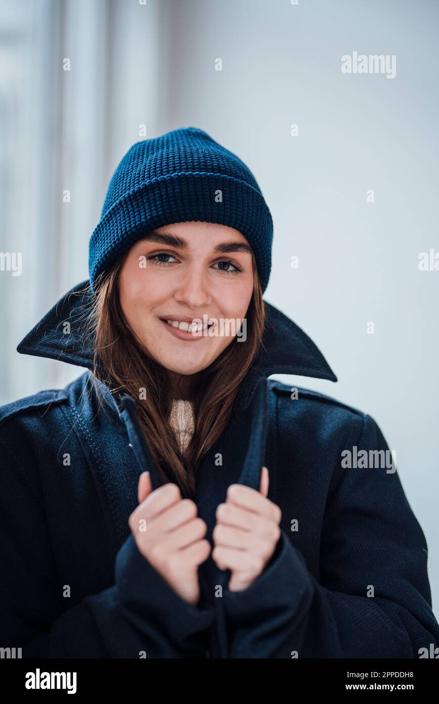 Happy young beautiful woman wearing knit hat Stock Photo