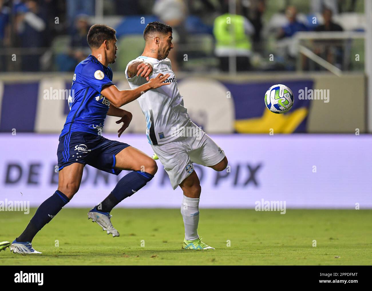 Rafael Navarro of Palmeiras competes for the ball with Claudinho