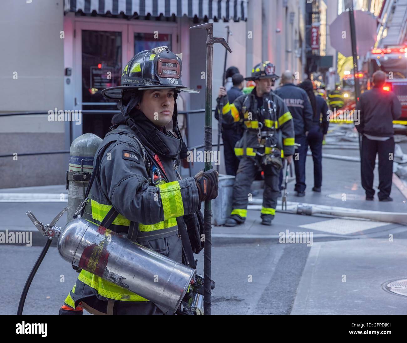 NEW YORK, N.Y. – April 18, 2023: First responders and others are seen near the site of a parking garage collapse in Lower Manhattan. Stock Photo