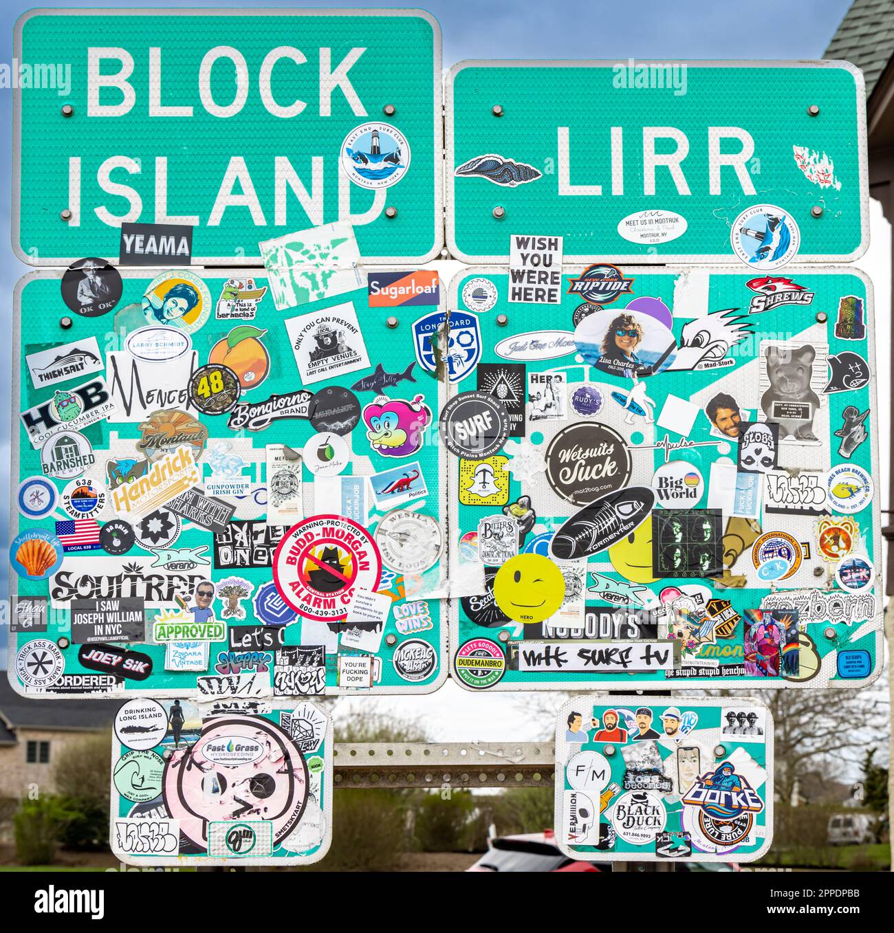 Roadside signs covered in stickers in Montauk, NY Stock Photo - Alamy